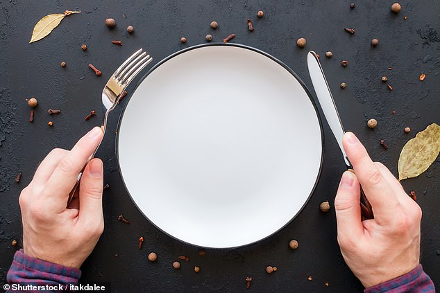 the correct way to brandish cutlery is to hold your knife with the index finger along the top of the handle. And forks should be held with the tines pointing downwards (stock image)