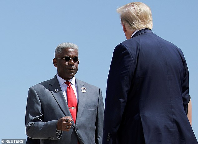 Texas Republican Chairman Allen West, a former congressman, did not wear a face mask to greet President Trump