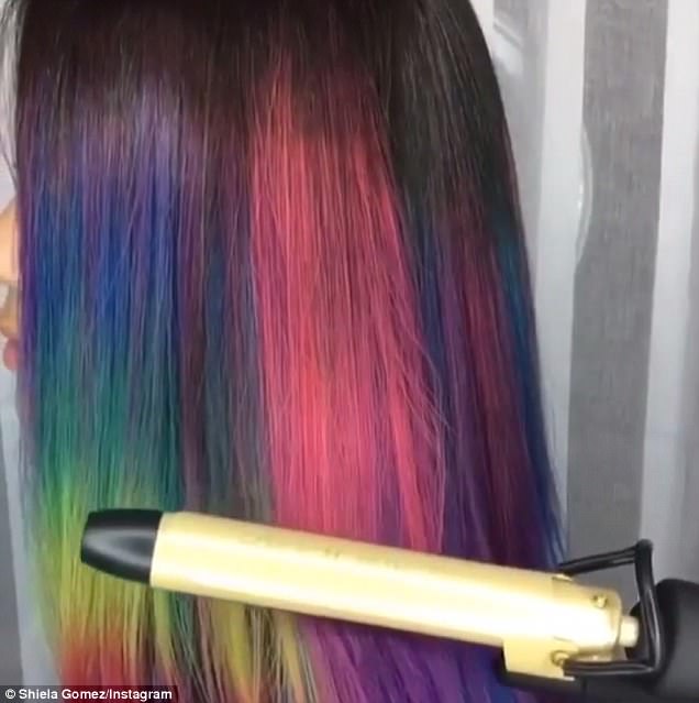From purple to pink: Taylor Rae , who is a Pravana Vivids specialist in Denver, Colorado, ran a hot curling iron over a client